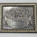WOODEN PLAQUE WITH PEWTER “FLOWER”